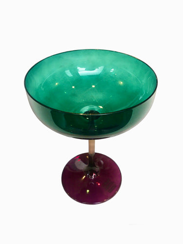 Green Champagne glass with purple stem.